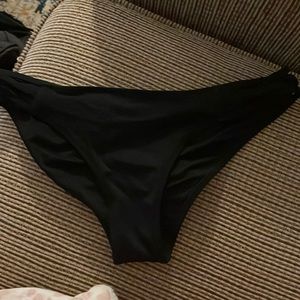 black bikini bottoms with crossed sides